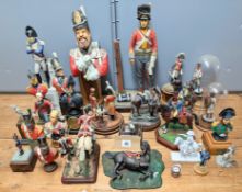 A collection of large scale painted and part-painted bust and figures of Napoleonic guards,