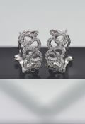 A pair of 18ct white gold 'Swirl' diamond earrings.