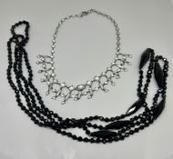 An opera length jet necklace together with a silver and white stone necklace (2).