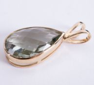 A 9ct yellow gold split bale pendant set with a fancy pear shaped green quartz, approx. 18 carats,