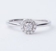An 18ct white gold cluster style ring set with round brilliant cut diamonds, total weight approx.