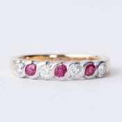 An 18ct yellow & white gold half eternity style ring set with diamonds and rubies, total diamond