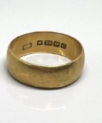 A 22ct yellow gold wedding and ring, approx 9.30g.