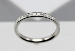 A platinum half eternity ring, set with princess cut diamonds, weight 0.50ct, colour F/G, clarity
