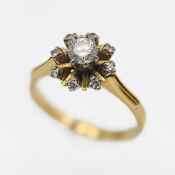 An 18ct yellow gold diamond cluster ring, size M/N.