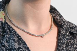 An impressive 18ct white gold diamond line necklace, approx diamond weight 10 carats.