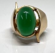 A gold and jade stone ring (not marked), size K/L, approx 9.9g.