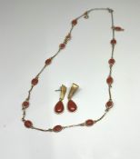 An 18ct yellow gold and coral set earrings and necklace