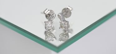 A pair of 18ct white gold diamond stud earrings, total weight 0.40ct.