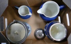 Two Wedgwood Dip Blue biscuit barrels with metal lids and handles together with two jugs, largest