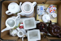 A collection of tea pots to include Sadler London, Golden age of travel, Cottage scene together with