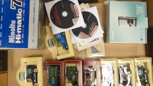 A collection of Days gone boxed toy cars together with Canon digital ixus 100IS camera and Minolta