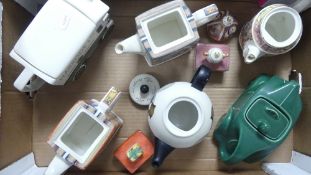 A collection of mostly Sadler novelty teapots to include racing car, Christmas carol, Alice in