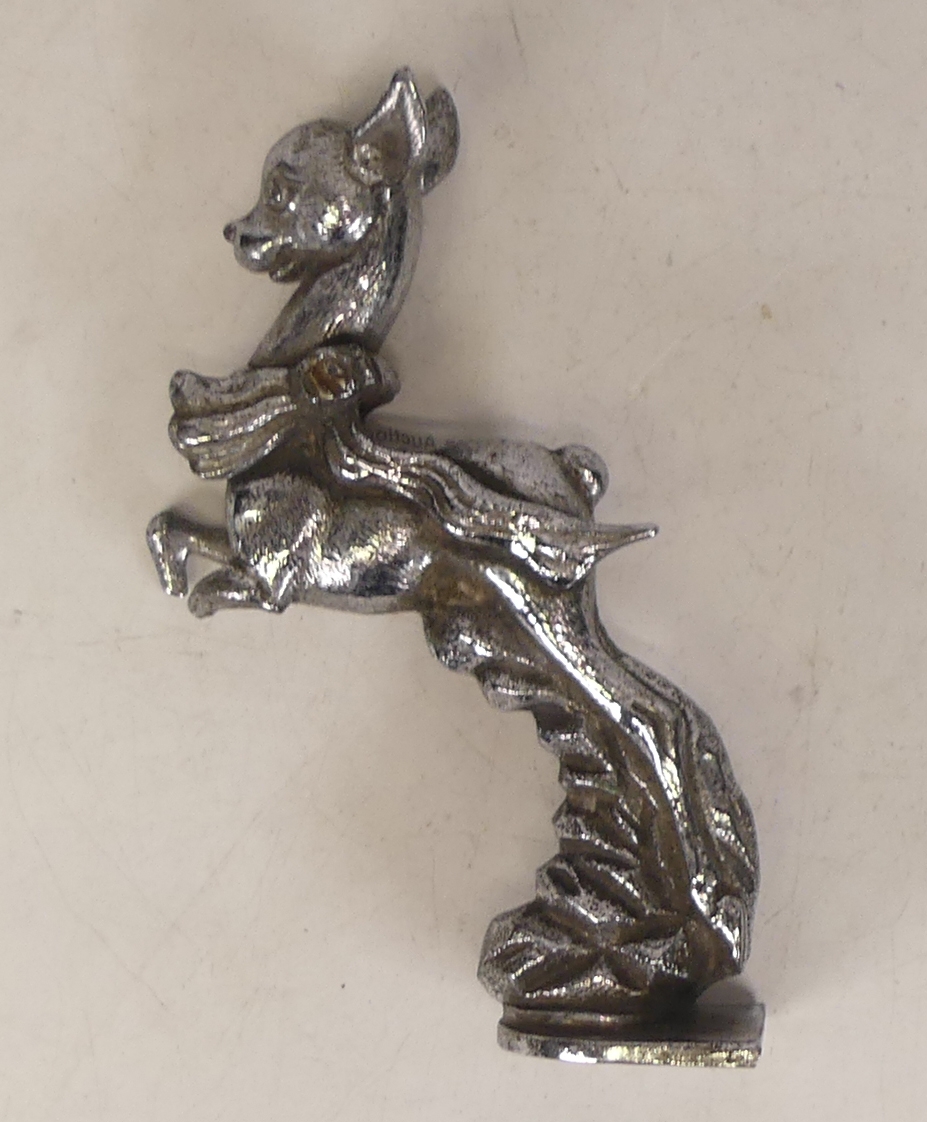 A Chrome Plated Babycham Car Mascot. Height: 16.5cm