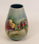 Moorcroft Freesia vase on faded blue ground. Height 13cm
