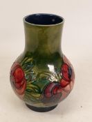Moorcroft Anemone vase on green background. Height 17.5cm , Potters to late Queen Mary stickers to