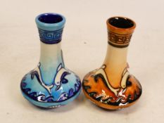 Two Moorcroft Myth Dolphins vases on blue and orange ground. Dated 2000 , height 11cm (2)