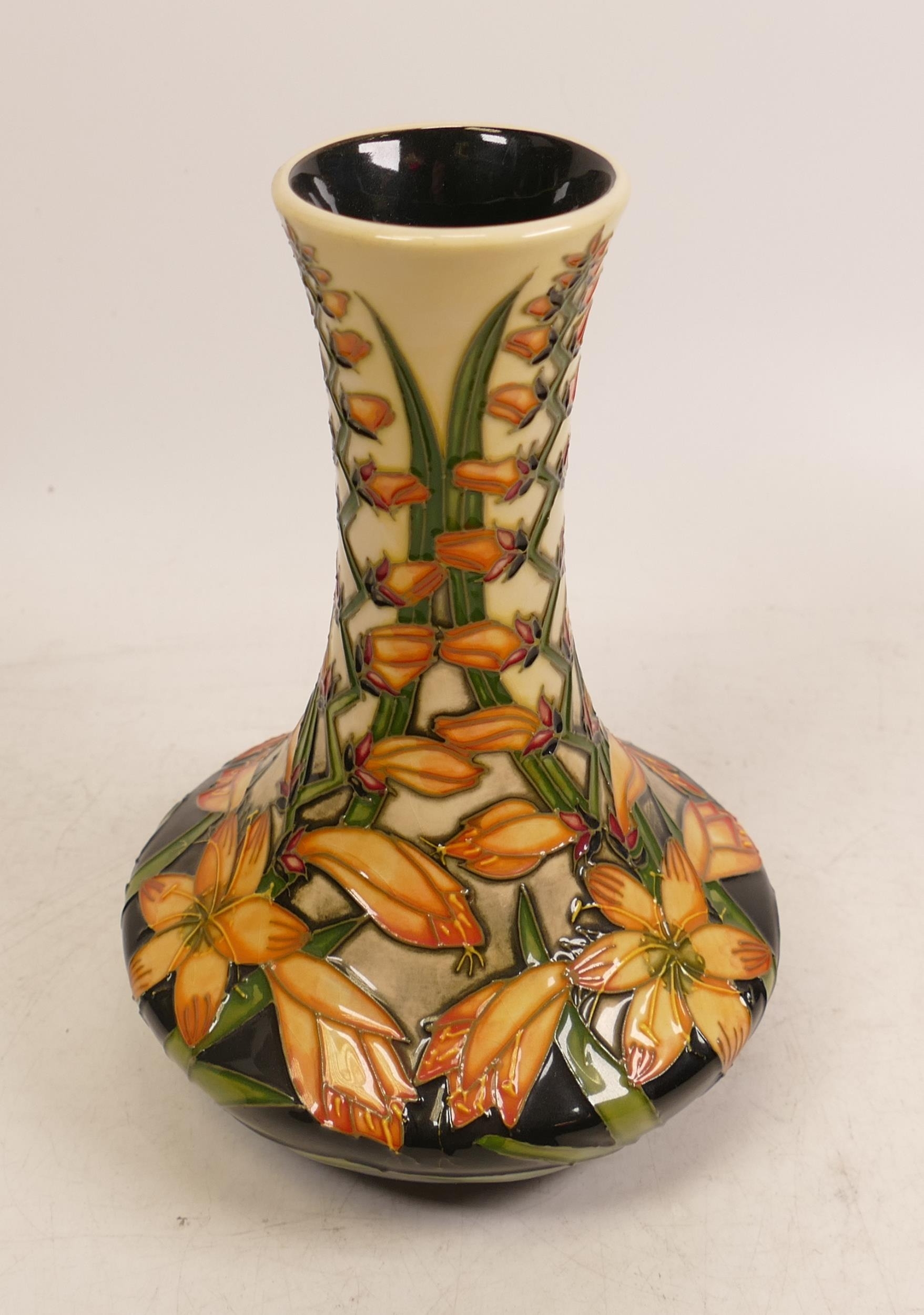 Moorcroft vase decorated with Orange flowers. M.C.C piece dated 2002 , limited edition 26/50. Signed
