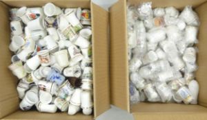 A mixed collection of thimbles to include country scenes, floral, places, etc (2 boxes)