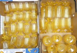 A Large Quantity of Tiffin Franciscan Mid-Century Yellow Glasses and Bowls (2 Trays)