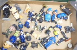 A large collection of novelty resin and ceramic figures of police theme (1 tray)