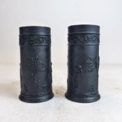 Pair 19th Century Wedgwood black basalt spill vases, decorated with classical scenes, h.12,5cm. (2)