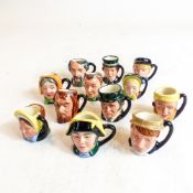 A complete set of Royal Doulton Dickens tiny character jugs, comprising Charles Dickens D6676,
