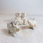 A collection of Beswick pigs, comprising two laughing pigs, piglet running and Piglet standing. (3)