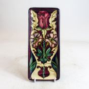 Moorcroft oblong tray decorated in the Masquerade design, dated 2000, L.20 x 8.5cm.