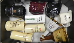 A collection of Wade water jugs and decanters to include Bell's decanters, White Whyte, Mackay,