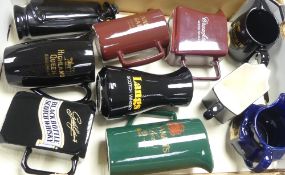 A collection of Wade water jugs and decanters to include Sandy Man, Highland Queen Whiskey,