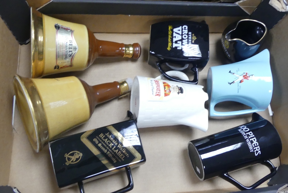 A collection of Wade water jugs and decanters to include Bells decanters, Beefeater, Johnny