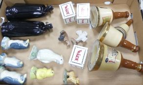 A mixed collection of wade to include Bell's Whiskey decanters, Sandy man, penguins, cockatoo,