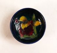 Moorcroft small bowl in the Orchid pattern on blue ground. Impressed Moorcroft Made In England to