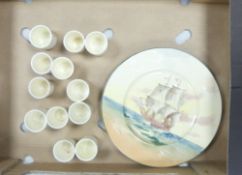 A Collection of 12 Royal Doulton Bunnykins Beatrix Potter Egg Cups and two Famous Ships Victory