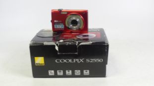 Nikon Coolpix S2550 4x Zoom, 12.0 Megapixels, HD Movie. Complete with CD's, cables and manuels.