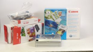 Canon Compact Printer Boxed, complete with CD, cables and manuals. Two boxes of KW-24IP and KC-