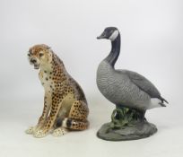 Two Large Ceramic Animals to include a Seated Cheetah and a Goose on naturalistic base Height of