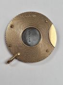 A 9ct gold and stainless steel cigar cutter, approx 3.5cm diameter with allover machine decoration t