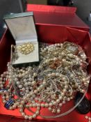 A quantity of vintage costume jewellery including a Wedgwood pendant, simulated pearls, etc