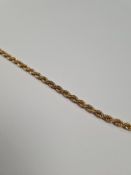 9ct gold rope twist bracelet, AF, marked 375 and a pair of 9ct gold oval cufflinks with machined dec