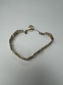 9ct yellow gold five bar gate link bracelet with heart shaped clasp and safety chain, marked 375, ma