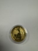 The Royal Mint; A 2023 24K Gold Britannia 1oz, £100 Proof coin, in capsule, 999.9 finesse, 31.2g