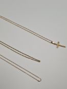 4 x 9ct yellow gold neckchains, AF, one hung with a 9ct gold cross pendant.