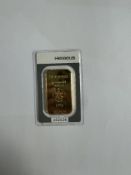 Heraeus; An as new 100g minted gold bar of 24K gold, in sealed package, serial number 602628