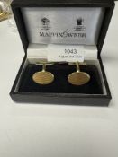 Mappin & Webb; a pair of 18ct yellow gold cufflinks of oval form and machined decoration, marked 750