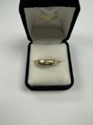 9ct gold wedding band inset with small diamond chip, marked 375, Birmingham, maker TAO, approx 3.44g