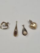 Three pretty 9ct gold pendants, one set with 2 small rubies, one a pearl and the other a heart shape