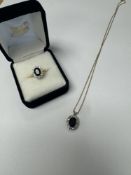 18ct yellow gold sapphire and diamond cluster ring, with central oval sapphire surrounded diamond ch