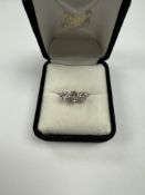 Early 20th Century Platinum diamond trilogy ring, with central old brilliant cut diamond approx 0.80
